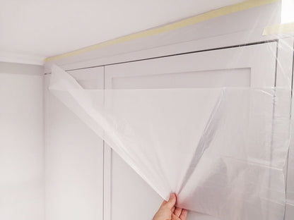 The folded film conveniently unfolds making it ideal for covering surfaces when working around painted walls and trim, windows and kitchen cupboards, doors and even windowsills and skirting boards.